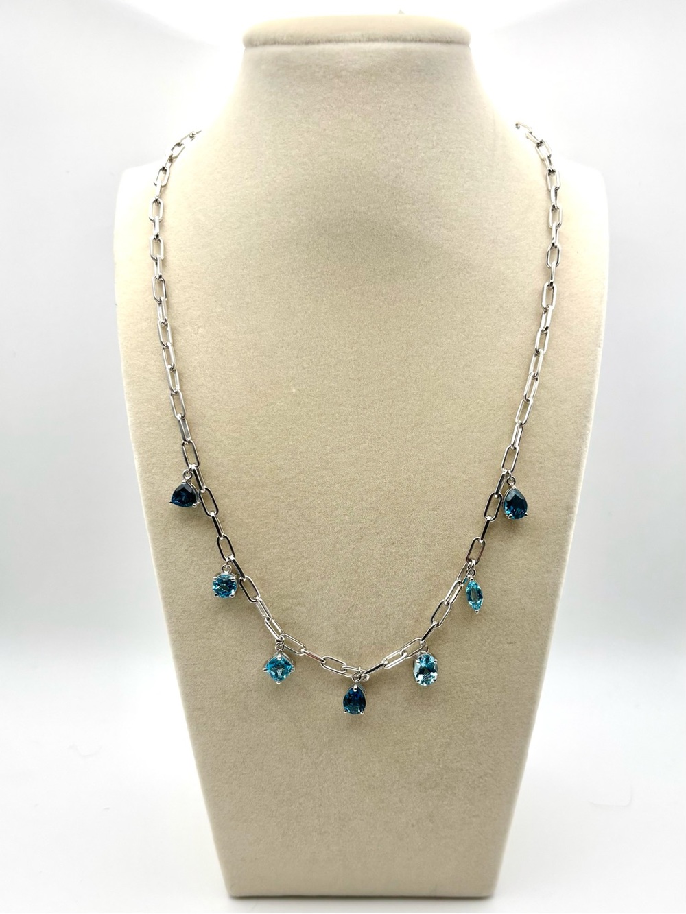 Silver necklace with blue topaz charms